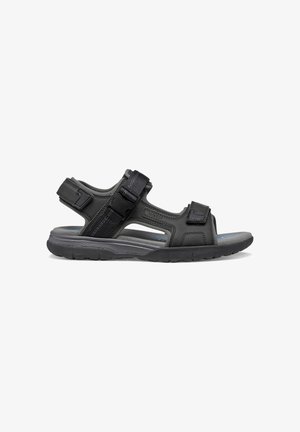 Sandalo uomo nero con punta aperta, cinturini regolabili e suola imbottita, progettato per un uso casual all'aperto e comfort.