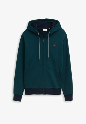 Dark green zip-up hoodie with hood, white and black drawstrings, front pockets, ribbed cuffs and hem, and small round logo on chest.