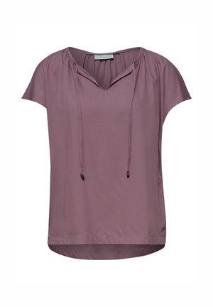 Hellviolette kurzärmlige Bluse mit gerafftem Ausschnitt und vorderen Bändern, aus glattem, leichtem Stoff.