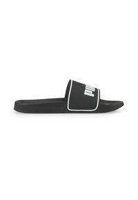 Black slide sandal with wide strap featuring white Puma logo and white trim, flat sole, side view on white background.