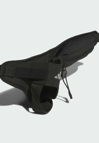 Black fabric waist pouch with a zippered compartment, elastic band, and textured finish. Features adjustable cord and logo accent.