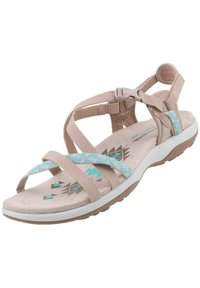 Sandale beige avec des sangles ajustables et un accent textile bleu à motifs. Semelle intérieure rembourrée et semelle en caoutchouc avec des motifs géométriques.