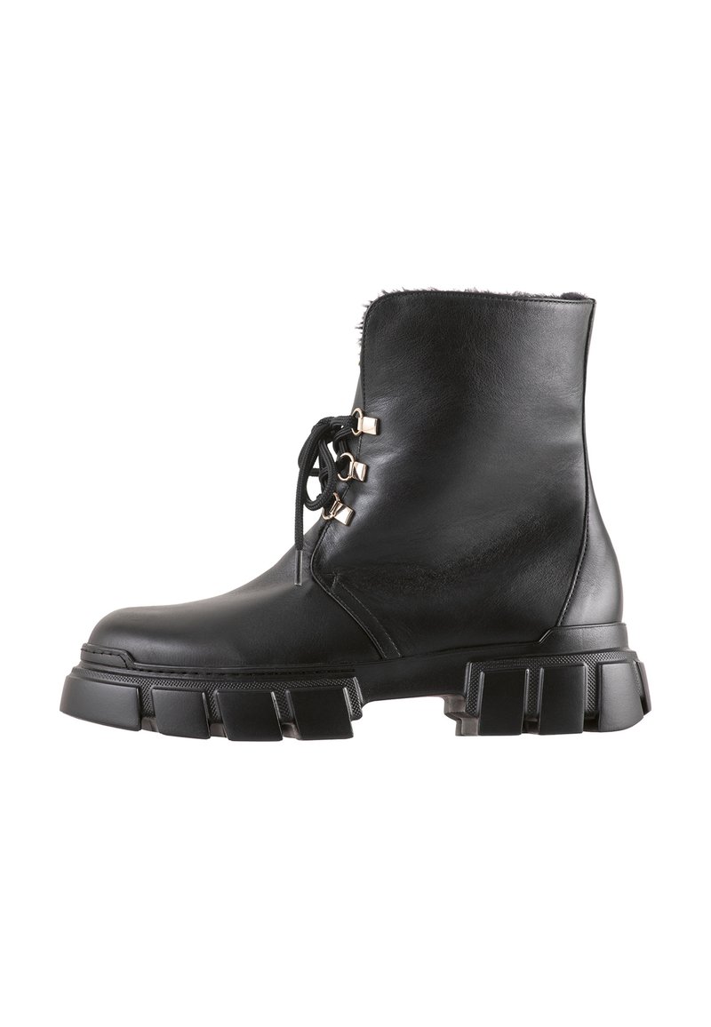 Black leather ankle boot with faux fur lining, rounded toe, lace-up design, and chunky platform sole with textured accents.