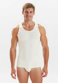 White tank top made of stretchy fabric, featuring wide shoulder straps and a fitted design. The texture is smooth with no visible patterns.