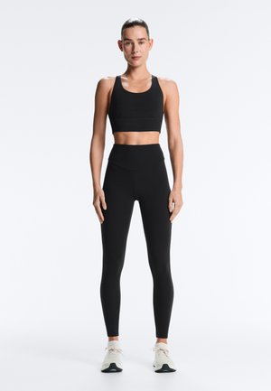 OYSHO STRAPPY BACK   - Medium support sports bra - black