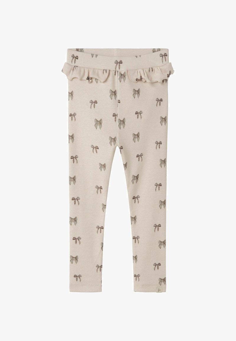 Kerged beige legginsid ribatud tekstuuriga, millel on korduv lipsumuster tuhmi pruuni värviga. Komplektsuses on ka volangvärvel.