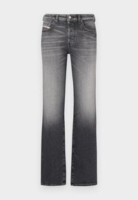 Flared jeans in a gradient black to gray wash. Features five pockets, a button and zipper closure, and belt loops. Denim fabric with a smooth texture.