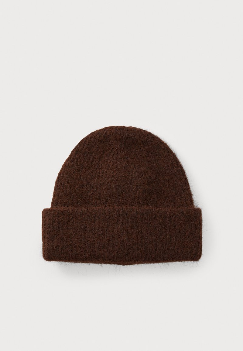 Brown knit beanie made from soft material with a textured finish, featuring a folded cuff detail for added warmth and style.