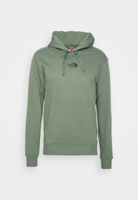 Felpa verde con cappuccio, in misto cotone, presenta una tasca a marsupio e un lacci regolabili. Logo The North Face visibile sul petto.