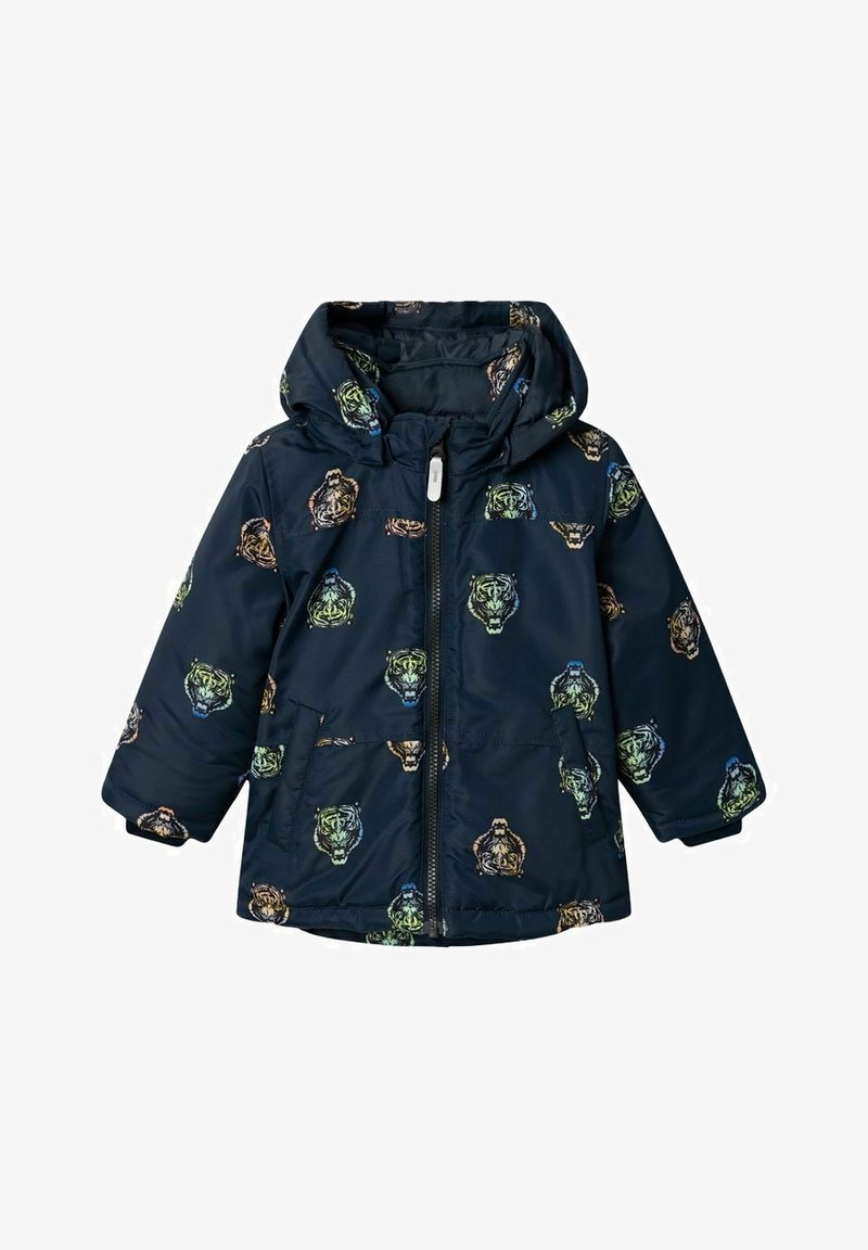 Mörkblå puffjacka med huva, med ett mönster av flerfärgade tigerhuvuden, framtida dragkedja och två sidofickor. Mjuk, quiltad textur.