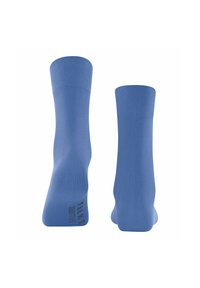 Chaussettes en coton bleu avec une surface texturée, dotées d'un bord côtelé et d'un logo imprimé sur le côté. Elles ont une longueur cheville avec une pointe arrondie.