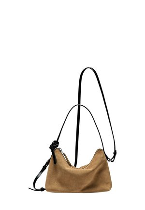 Suede handbag in light brown with a rounded shape, black adjustable strap, contrasting zipper detail, and a soft texture.