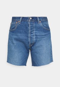 Jean-shorts i medelblått med hög midja, traditionell femfickdesign och fransad nederkant. Tyget har en klassisk stonewash-finish.