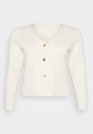 Cardigan crema realizzato in tessuto morbido, con scollatura a V, maniche lunghe e cinque bottoni dorati sul davanti. Design con fondo svasato.