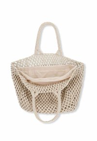 Geweven beige draagtas met een netdesign en twee stevige handvatten. De binnenkant heeft een effen, lichtgekleurde stofvoering.