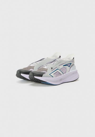 Sport shoes in gray and lavender with a mesh upper, padded tongue, and black rubber sole. Features abstract accents in blue on the side.