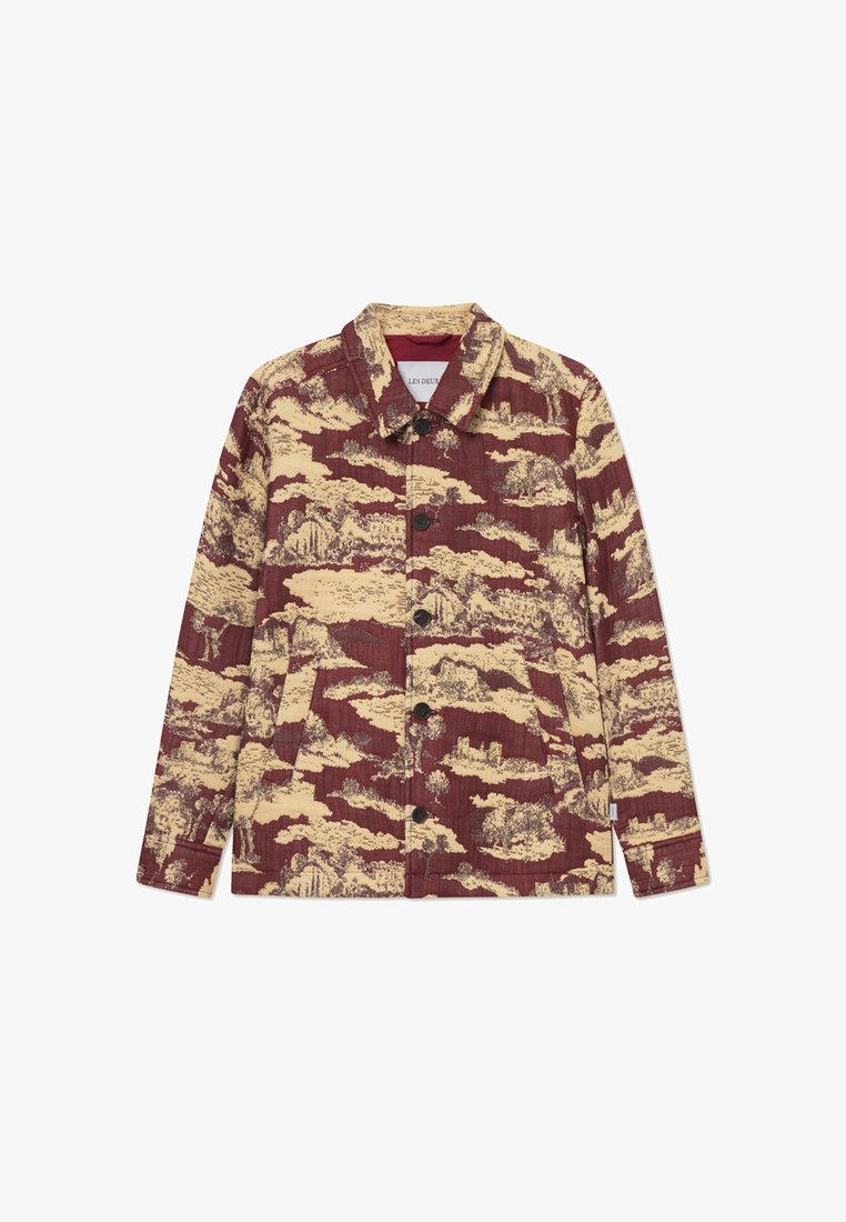 Burgundi värvi jakk, millel on tekstureeritud kangas kollase maastiku mustriga, nööbid, mis klõpsavad kinni, ja küljetaskud. Klassikaline kraedisain.