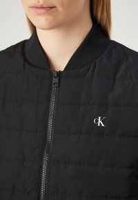 Calvin Klein Jeans QUILTED - Overgangsjakke - black