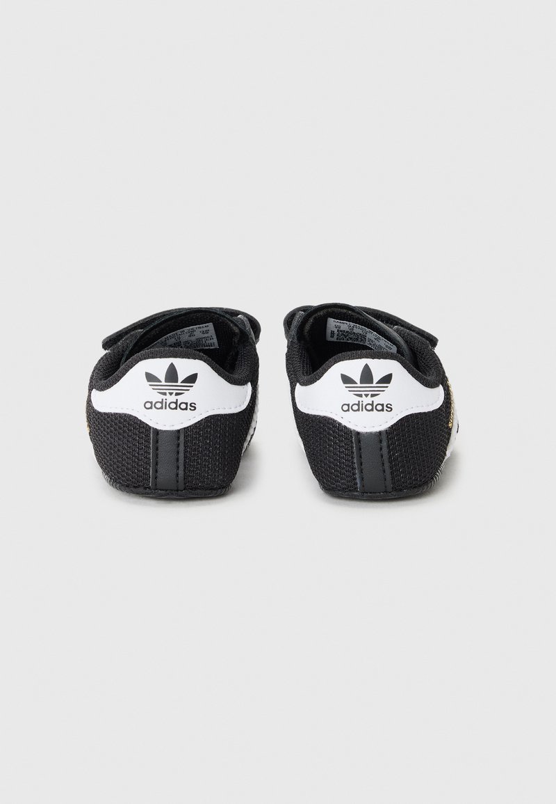 adidas Originals SUPERSTAR CRIB UNISEX - First shoes -  black/white/gold-coloured/black - Zalando.ie