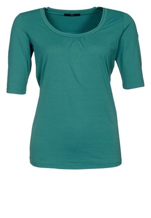 Tyrkysový krátký rukáv s kulatým výstřihem a nařaseným detailem vpředu, vyrobený z měkké, elastické látky.