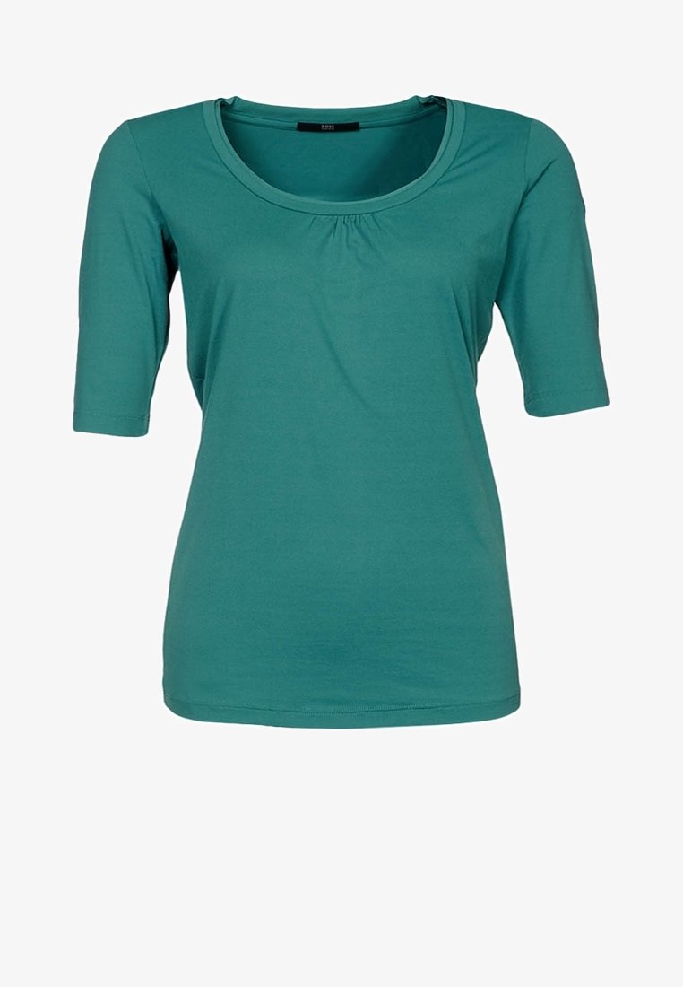 Haut bleu sarcelle à manches courtes avec un col rond et un détail froncé à l'avant, confectionné dans un tissu doux et extensible.