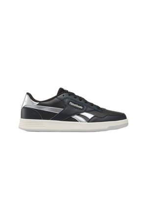Low-top Reebok sneaker in black leather with silver accents and white sole, featuring Reebok logo on side and tongue.