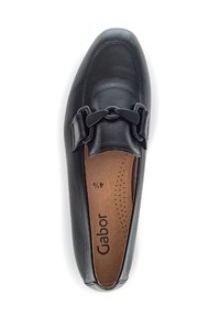 Black leather loafers with a rounded toe, featuring a decorative black buckle on the vamp and a brown cushioned insole with perforations.