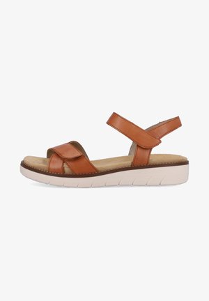 Brown leather sandal with cross-over straps and adjustable ankle strap. Features a light rubber sole with textured grooves.