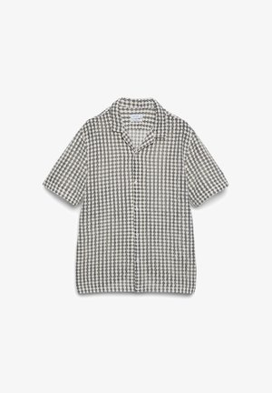 Kurzärmliges Hemd mit Knopfleiste, schwarzem und weißem geometrischem Rastermuster und einem Hemdkragen.
