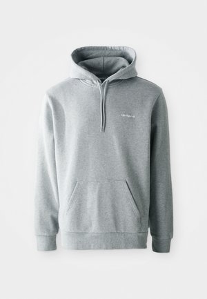 Gray hoodie with a front pouch pocket, drawstring hood, and ribbed cuffs and hem. Features a small logo on the chest. Soft material.