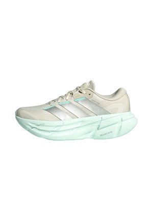 Hellbeiger Laufschuh mit silbernen Streifen und dicker hellblauer Sohle mit der Aufschrift „DREAMSTRIKE“, Seitenansicht vor weißem Hintergrund.