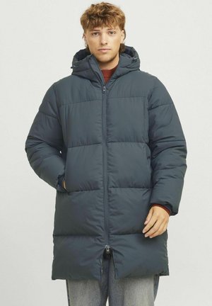Padded hooded coat in dark grey, featuring a zip front, side pockets, and a long silhouette. Smooth texture with a quilted design.