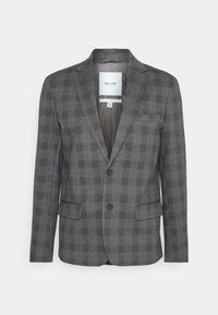 Blazer a scacchi grigio con due bottoni, colletto a revers e tasche frontali. L'interno presenta una fodera liscia. Il motivo del tessuto è predominante.