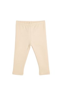 Leggings de algodón beige con una textura suave, cinturilla elástica y diseño de longitud hasta el tobillo. Sin patrones visibles ni detalles metálicos.