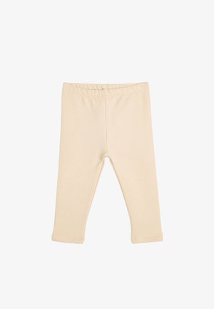 Beige bomulds leggings med en glat tekstur, elastisk talje, og ankel-længde design. Ingen synlige mønstre eller hardware detaljer.