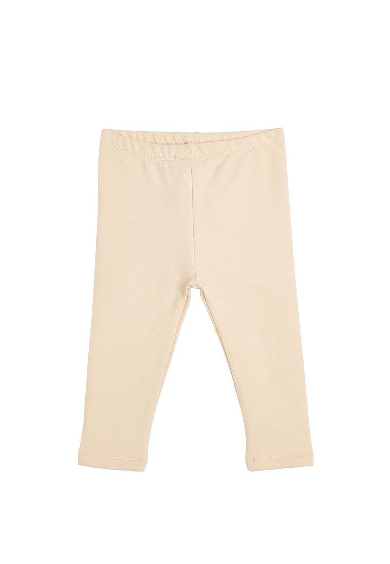 Leggings de algodón beige con una textura suave, cinturilla elástica y diseño de longitud hasta el tobillo. Sin patrones visibles ni detalles metálicos.