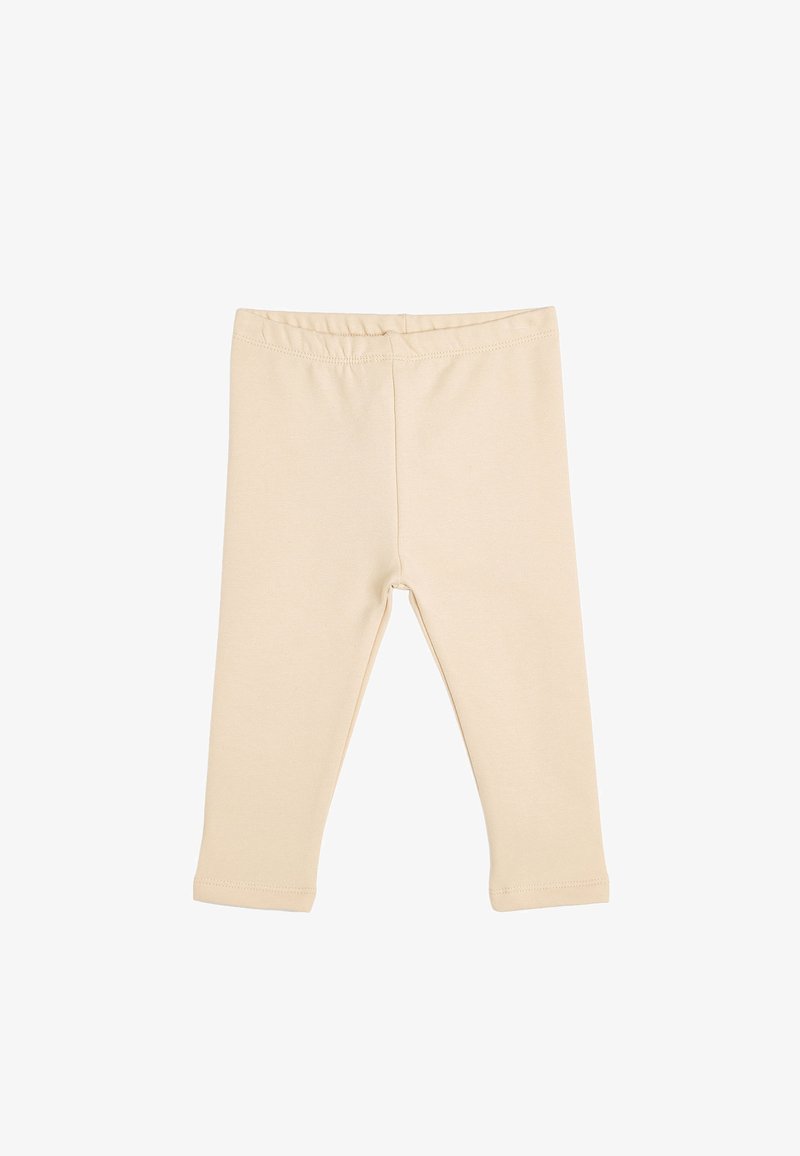 Leggings de algodón beige con una textura suave, cinturilla elástica y diseño de longitud hasta el tobillo. Sin patrones visibles ni detalles metálicos.