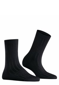 Schwarze Socken mit gerippter Textur und subtilen vertikalen Linien. Das Material ist glatt und verfügt über verstärkte Zehen- und Fersenbereiche.