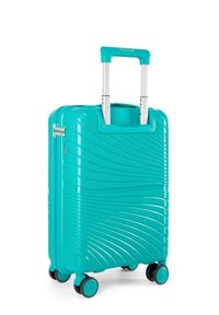 Valigia rigida turchese con texture ondulata, manico retrattile, quattro ruote nere e chiusura a zip. Design compatto e adatto per i viaggi.