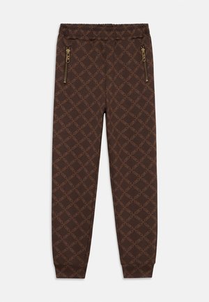 Brune joggebukser med mønster av lenker over hele, elastisk midje, glidelåslommer på siden og nedre kant med ribb.