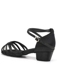Black strappy sandal made of fabric with a low heel. Features multiple crisscrossing straps and an adjustable ankle buckle.