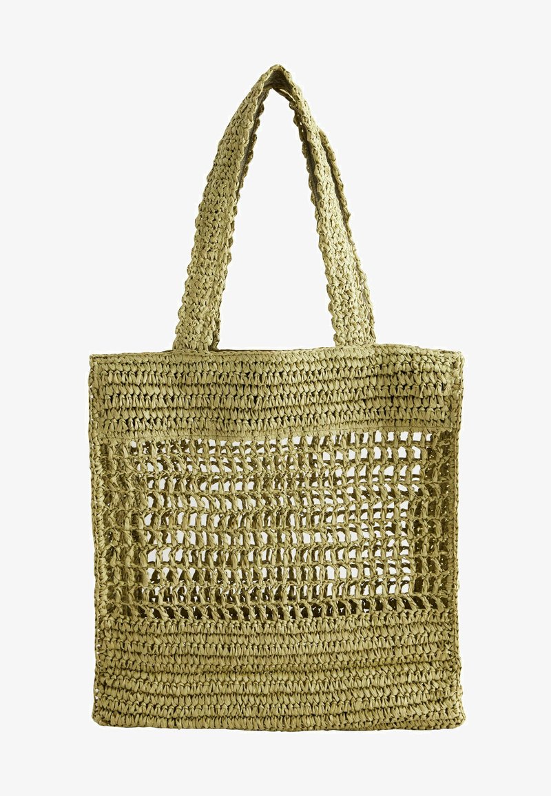 Vävd halmshoppar i ljusgrön, med en texturerad, öppen vävdesign och stadiga handtag för enkel bärning.