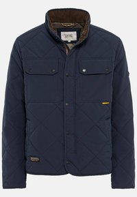Gep quiltete marineblaue Jacke mit aufknöpfbaren Taschen, Cordkragen und gelbem Akzent. Sie hat einen geraden Schnitt und eine glatte Textur.