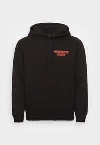 Sudadera negra de Calvin Klein Jeans con cordones frontales y texto de logo rojo en la parte superior del pecho, puños y dobladillo acanalados.