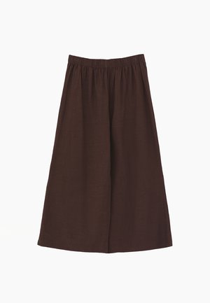 Braune weite verkürzte Hose mit elastischem Bund, aus leichtem Stoff, vor weißem Hintergrund gezeigt.