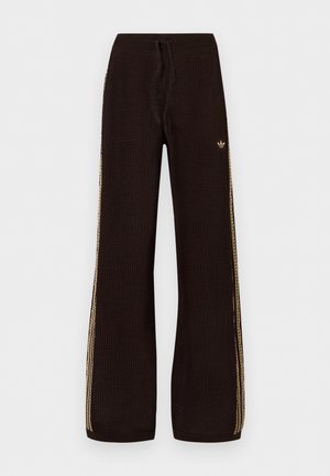 Μαύρο πλεκτό παντελόνι με φαρδιά παντελόνα, μπεζ πλευρικές ρίγες, ελαστική μέση, κορδόνι και μικρό λογότυπο στο αριστερό μηρό.