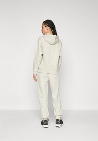Puma LOUNGEWEAR TRACKSUIT SET - Tracksuit - desert dust