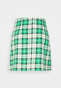 Jupe mini à carreaux verts avec des accents blancs et marins, présentant une coupe droite, une texture subtile et une fermeture éclair dissimulée à l'arrière.