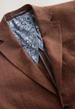 Brown blazer with a textured fabric, featuring a blue floral patterned lining and grey accent piping along the inner edges.