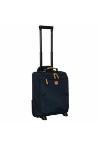 Valigia da viaggio blu navy con manico nero retrattile, due tasche anteriori con zip, dettagli color beige e una base solida per la stabilità. Esterno in tessuto testurizzato.